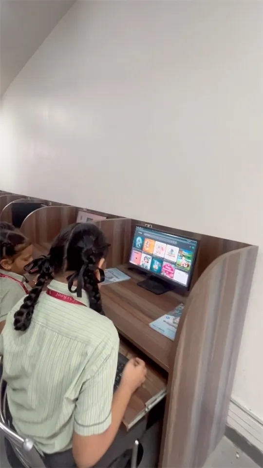 Computer lab with individual workstations at Skonis World School