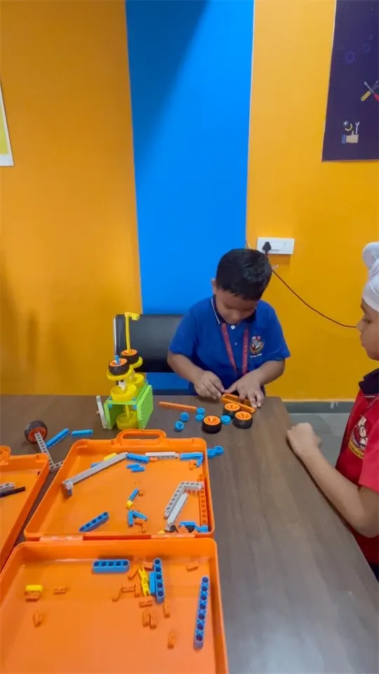 Students building in the robotics lab at Skonis World School
