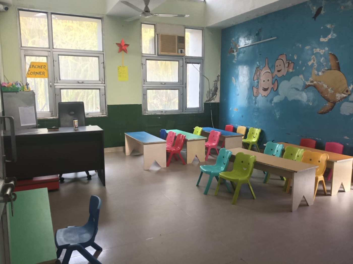 A bright classroom with small desks